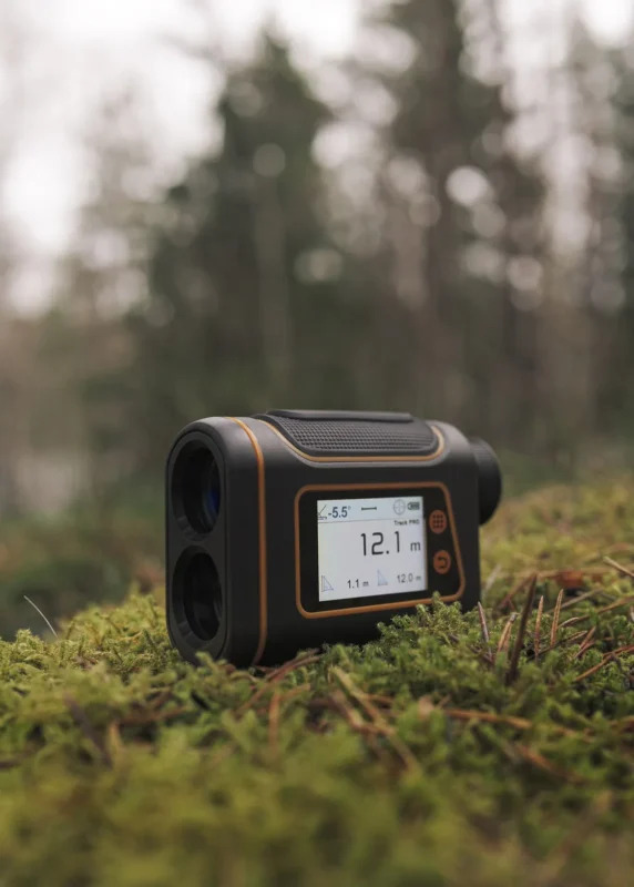 Rangefinder display showing a distance, with moss behind