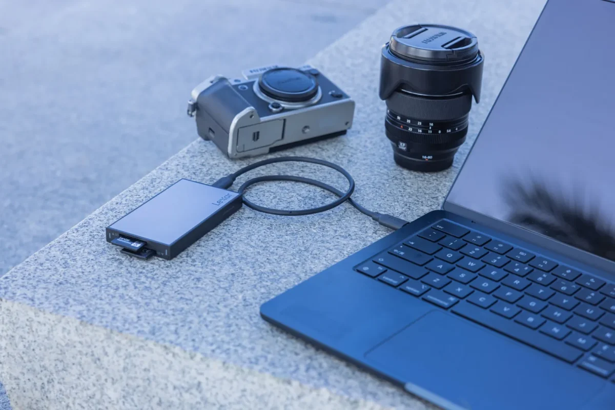 External SSD cabled to a laptop next to camera gear