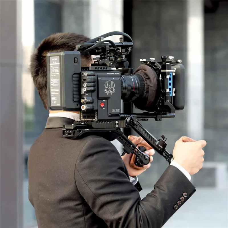 Shooter running with a cinema camera on a shoulder rig