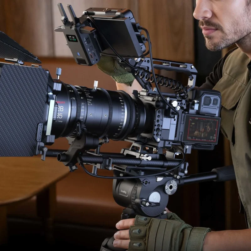 Cinema camera on rods with a matte box and several accessories mounted
