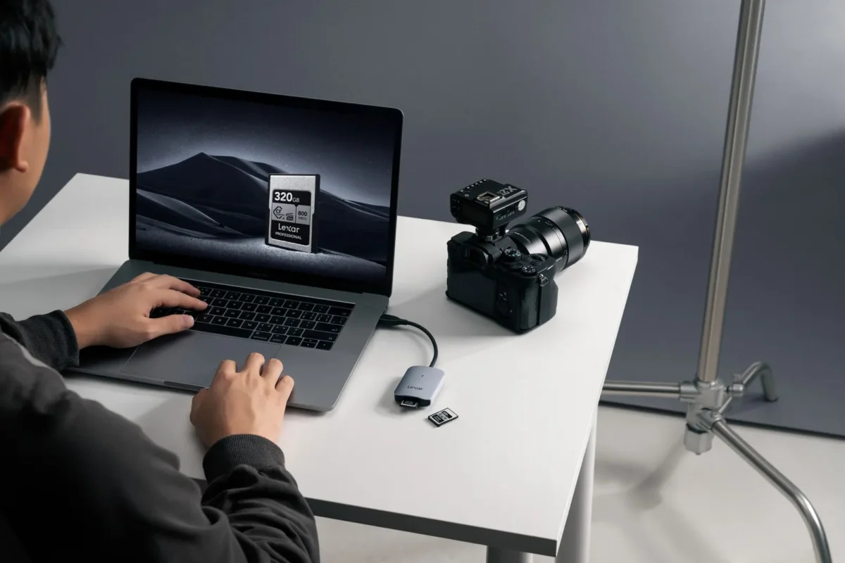 Photographer offloading memory cards at the desk