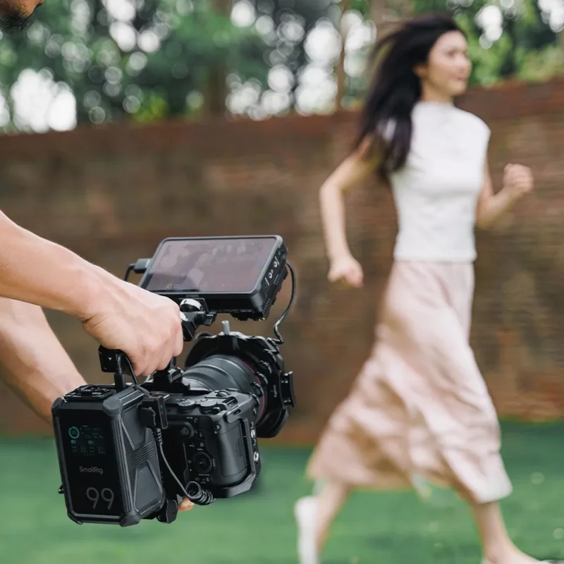 Caged camera held low, following a person walking