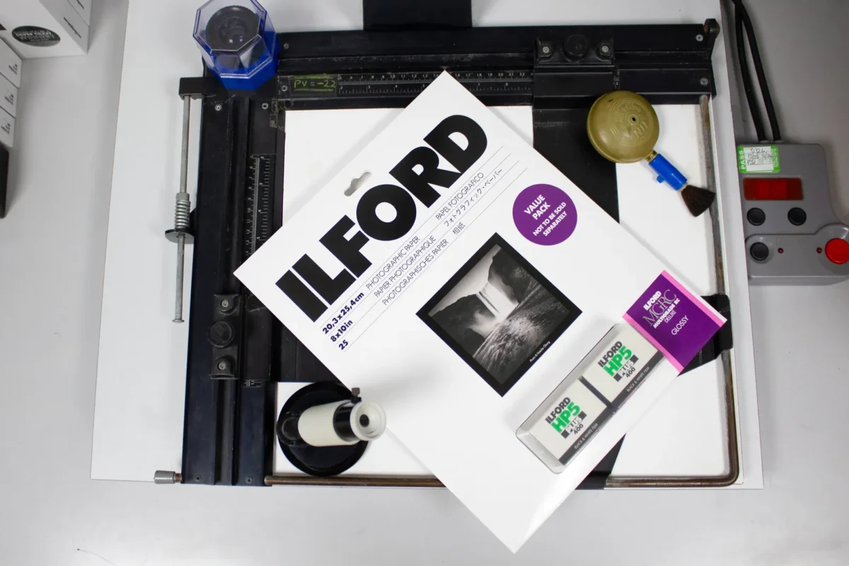 Box of Ilford photo paper on an enlarging easel in the darkroom