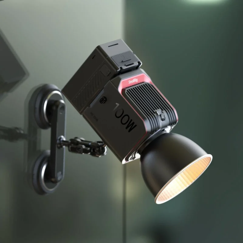 Compact studio light on a wall bracket in a warm room