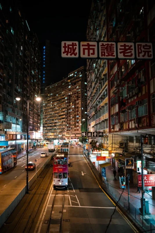 Busy street at night with neon signs