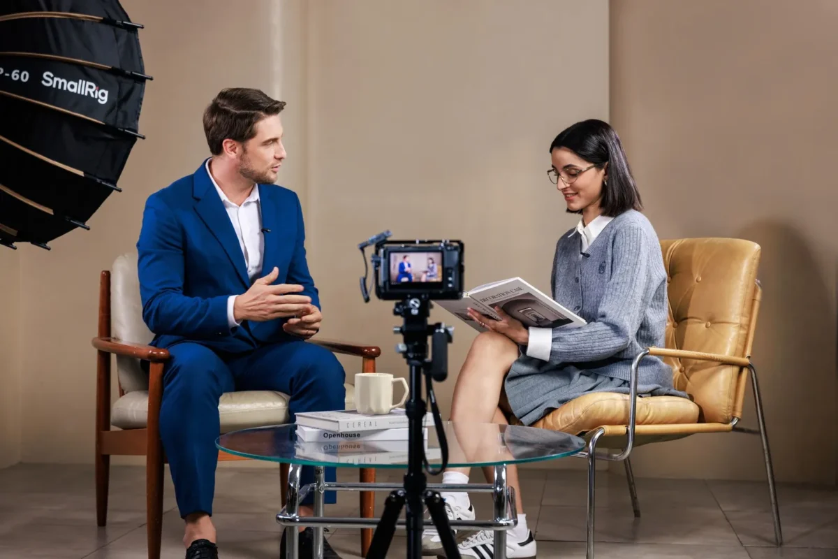 Two people interviewed with small wireless microphones on their clothes