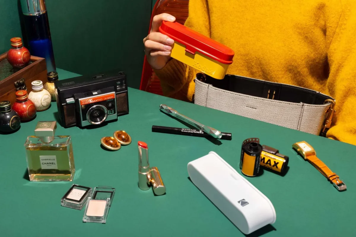 Film photography gear laid out on a green table